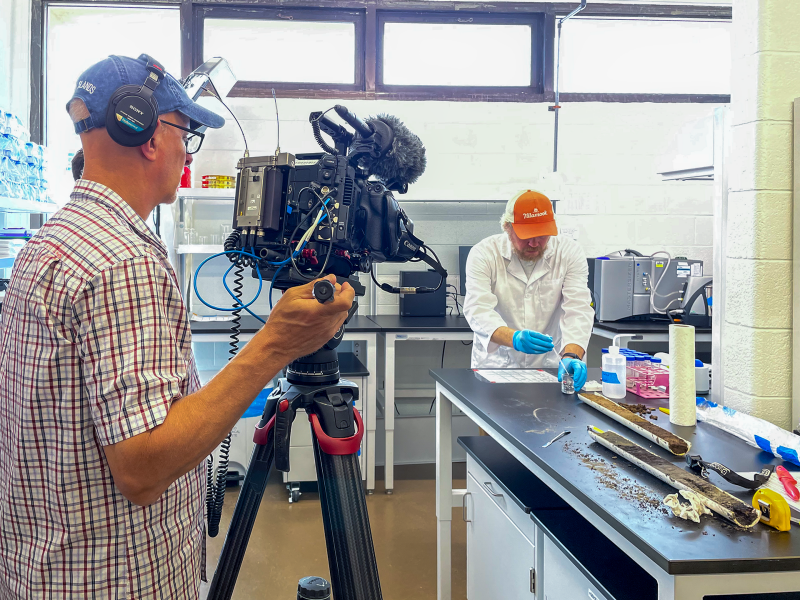 Researcher being interviewed by PBS video team