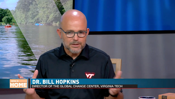 Bill Hopkins shown being interviewed for a television feature