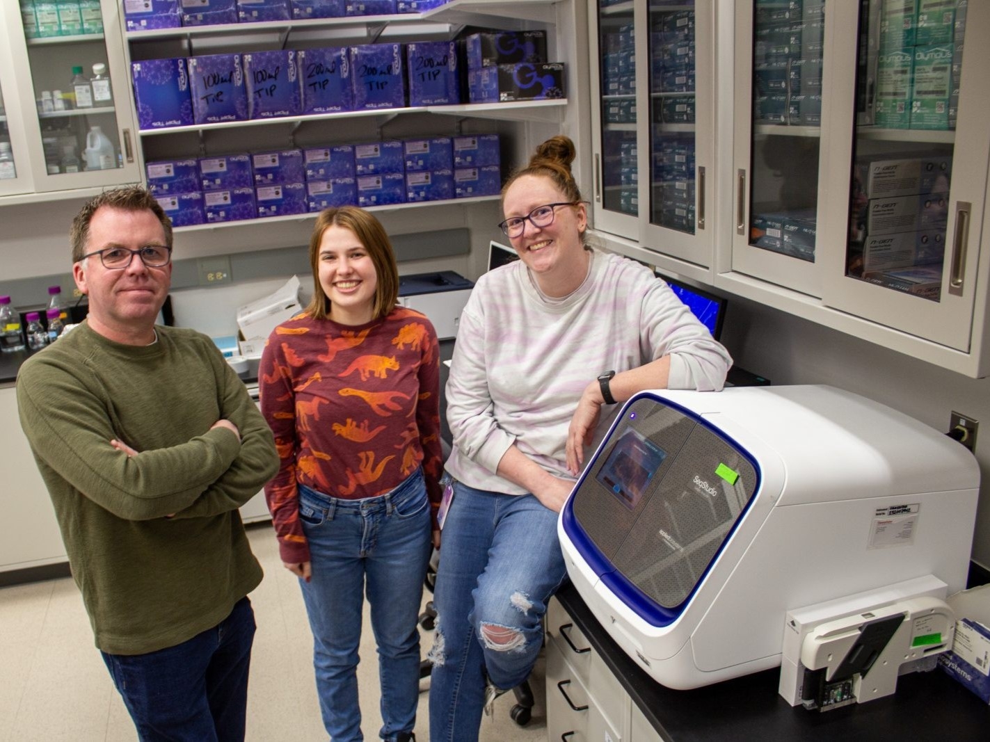 (From left) Yeeun Bae and Morgan Patrick, both Ph.D. students, work with Associate Professor Tim Jarome to help identify distinct molecular differences in how the brains of victims and witnesses process trauma. Photo by Marya Barlow for Virginia Tech.