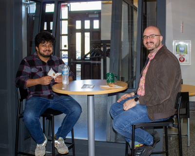 Two individuals seated in conversation for the Fralin Fridays gathering sponsored by the Fralin Life Sciences Institute. 