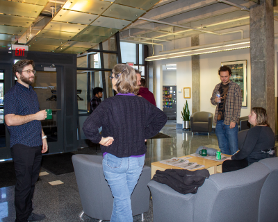 Group of individuals standing conversation for the Fralin Fridays gathering sponsored by the Fralin Life Sciences Institute. 