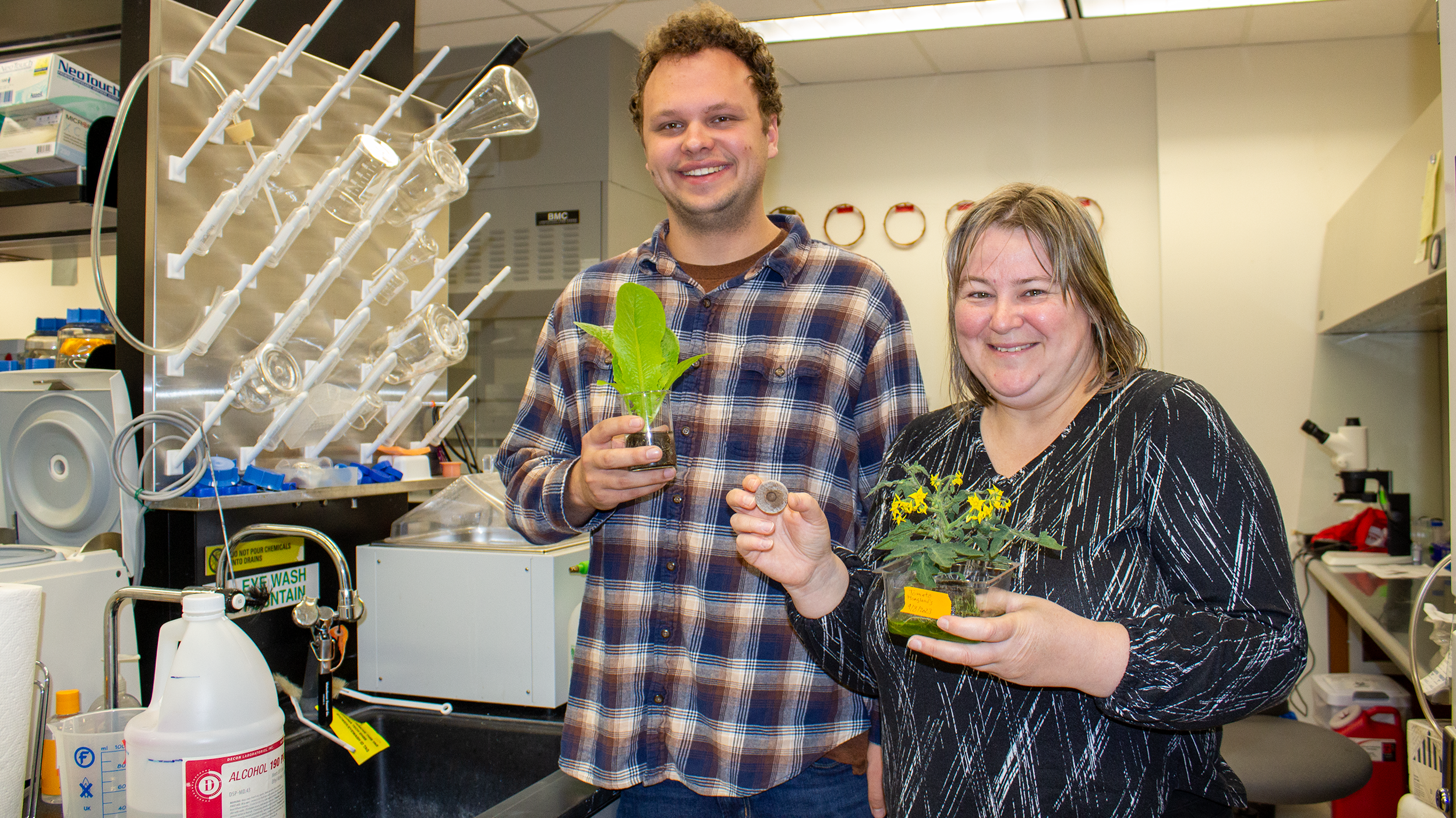 Two Translational Plant Sciences Center faculty in a lab setting.