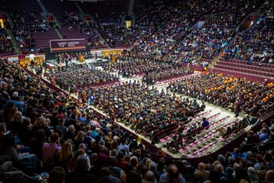 This photo is of the graduates in their robes inside Cassell Coliseum.