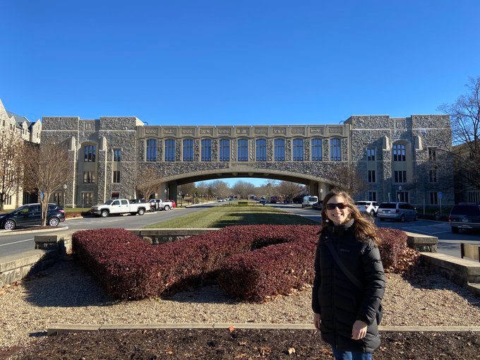 Natalie Nelson stands in front of Torgersen Hall Bridge on the Virginia Tech campus.