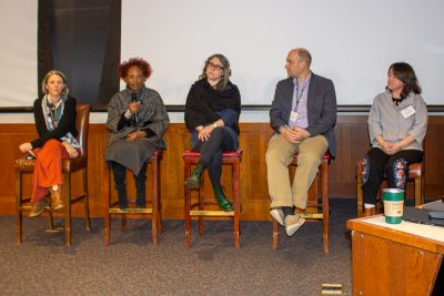 Panelists seated on high tops for the Translational Plant Sciences Center annual symposium's panel discussion.