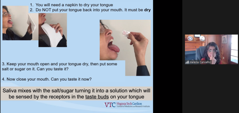 A woman demonstrates an activity about taste buds. Kids are asked to dry out their tongues and see if they can taste sugar or salt. Because the taste buds are not mixing with saliva, the kids can not taste anything.